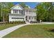 Two-story home with white exterior and front porch at 768 Maynard Ln, Summerville, SC 29486