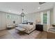 Main bedroom with a king-size bed and sitting area at 768 Maynard Ln, Summerville, SC 29486