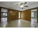 Living room with wood paneling and ceiling fan at 93 Deepwater Ave, Round O, SC 29474