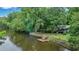 Charming riverside home with private dock and lush landscaping at 93 Deepwater Ave, Round O, SC 29474