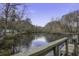 Peaceful waterfront view with a wooden dock and calm waters at 93 Deepwater Ave, Round O, SC 29474