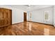 Bright bedroom featuring hardwood floors and ample natural light at 9681 Two Pines Rd, McClellanville, SC 29458