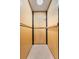 Small residential elevator with wood paneling at 9681 Two Pines Rd, McClellanville, SC 29458