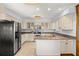 Eat-in kitchen with granite countertops, light cabinets, and stainless steel appliances at 9681 Two Pines Rd, McClellanville, SC 29458