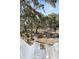 White wooden stairs leading down from deck to yard at 9681 Two Pines Rd, McClellanville, SC 29458
