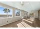 Bright sunroom with multiple windows, providing ample natural light and views at 9681 Two Pines Rd, McClellanville, SC 29458
