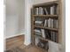 Stylish wooden bookshelf filled with various books adding a touch of sophistication at 1052 Old Cypress Run, Hanahan, SC 29410