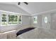 Bright bedroom with large windows, wood floors, and backyard view at 1106 Old Highway 6, Cross, SC 29436
