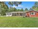 Brick ranch house with a large front yard and mature trees at 1106 Old Highway 6, Cross, SC 29436