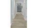Long hallway with light walls and hardwood floors at 1106 Old Highway 6, Cross, SC 29436