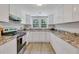 Bright kitchen featuring white cabinets and granite countertops at 1106 Old Highway 6, Cross, SC 29436