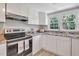 Modern kitchen with stainless steel appliances and granite countertops at 1106 Old Highway 6, Cross, SC 29436