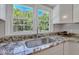 Kitchen sink with granite countertop and view of backyard at 1106 Old Highway 6, Cross, SC 29436