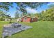 Stone patio with a seating area and lush green lawn at 1106 Old Highway 6, Cross, SC 29436