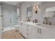 Double vanity bathroom with a large shower and gold fixtures at 1150 Valdosta St # 404, North Charleston, SC 29405