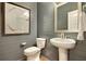 Powder room with pedestal sink and gray shiplap walls at 117 Crosscut Ln, Summerville, SC 29486