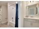 Guest bathroom with tub shower, vanity and white tile at 117 Crosscut Ln, Summerville, SC 29486