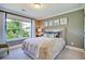Serene bedroom with a queen bed, neutral color palette and natural light at 117 Crosscut Ln, Summerville, SC 29486