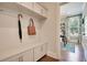 Drop zone with built-in bench, cabinets, and hooks for bags and coats at 117 Crosscut Ln, Summerville, SC 29486