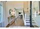 Light-filled entryway with hardwood floors, a console table, and a view into the living area and staircase at 117 Crosscut Ln, Summerville, SC 29486