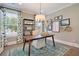 Bright home office features built-in shelving and hardwood floors at 117 Crosscut Ln, Summerville, SC 29486
