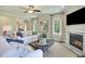 Spacious living room with a fireplace, large windows and comfortable seating area at 117 Crosscut Ln, Summerville, SC 29486
