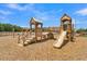 Wooden playground structure with slide and climbing features at 117 Crosscut Ln, Summerville, SC 29486