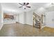 Open living space with kitchen, tile floors and stairs at 117 Venezia Ct, Ladson, SC 29456