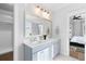 Elegant bathroom with double vanity, marble flooring, and a large mirror at 1213 Captain Rivers Dr, Charleston, SC 29412