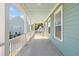 A relaxing front porch with white railings and a view of the neighborhood at 1213 Captain Rivers Dr, Charleston, SC 29412