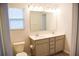 Bright bathroom with double vanity, large mirror, and shower at 156 Surfbird Rd, Summerville, SC 29486