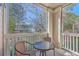 Relaxing balcony with screened enclosure, seating area, and community views at 1600 Long Grove Dr # 914, Mount Pleasant, SC 29466