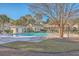 Inviting community pool with lounge chairs, tables, and lush landscaping at 1600 Long Grove Dr # 914, Mount Pleasant, SC 29466