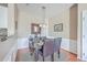 Dining area with table, chairs, decorative mirror, and view of the kitchen at 1600 Long Grove Dr # 914, Mount Pleasant, SC 29466