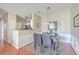 Open dining area adjacent to the kitchen with seating for four at 1600 Long Grove Dr # 914, Mount Pleasant, SC 29466