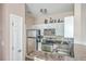 Compact kitchen with stainless steel appliances, white cabinetry, and granite countertops at 1600 Long Grove Dr # 914, Mount Pleasant, SC 29466