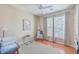 Home office with wood floors, large windows, and comfortable seating at 1600 Long Grove Dr # 914, Mount Pleasant, SC 29466