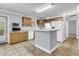 Kitchen with wood cabinets, white appliances, and an island at 1613 Cavanaugh Rd, Walterboro, SC 29488