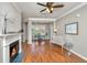 Living room with hardwood floors, fireplace, and built-in shelving at 1631 Chatelain Way, Mount Pleasant, SC 29464