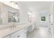 Elegant bathroom with double vanity, quartz countertop and walk-in shower at 1643 Cultivation Lane Dr # 450, Mount Pleasant, SC 29466