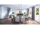Open concept dining area with a table for six, adjacent to a staircase and living room at 1643 Cultivation Lane Dr # 450, Mount Pleasant, SC 29466
