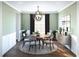 Bright dining room with a round table, four chairs, and an elegant chandelier at 1643 Cultivation Lane Dr # 450, Mount Pleasant, SC 29466