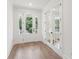 Light-filled entryway featuring hardwood floors and French doors at 1643 Cultivation Lane Dr # 450, Mount Pleasant, SC 29466