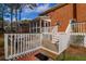 Back deck with stairs and screened porch access at 201 Castle Harbor Dr, Summerville, SC 29483