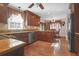 Spacious kitchen with granite countertops, dark wood cabinets, and stainless steel appliances at 201 Castle Harbor Dr, Summerville, SC 29483