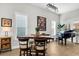 Dining area with a table, chairs, piano, and stylish light fixture at 206 River Martin Ct, Summerville, SC 29483