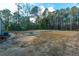 Large backyard with fire pit and partially cleared land at 212 Gardeners Walk, Cross, SC 29436