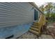 Exterior view showing stairs and siding at 212 Gardeners Walk, Cross, SC 29436