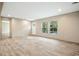 Living room with neutral tones, wood-look floors, and entryway at 212 Gardeners Walk, Cross, SC 29436