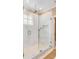 Large walk-in shower with marble tile and glass enclosure at 2204 Waterway Blvd, Isle of Palms, SC 29451